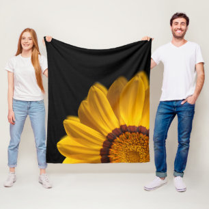 Yellow flower on  black background fleece blanket