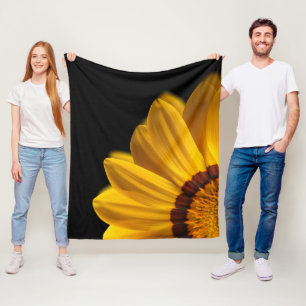 Yellow flower on  black background fleece blanket