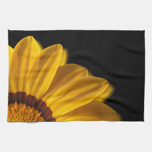 Yellow flower on black background tea towel