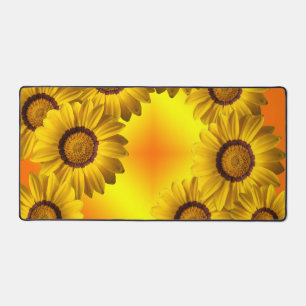 Yellow flowers in sunlight desk mat