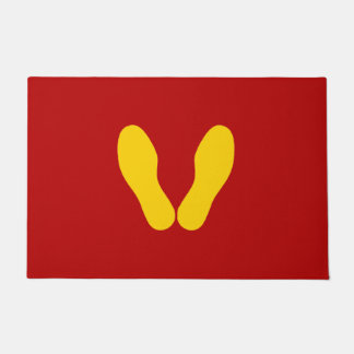 YELLOW FOOTPRINTS ON RED DOORMAT
