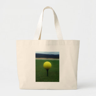 Yellow Golf Ball on a mountain golf course Large Tote Bag