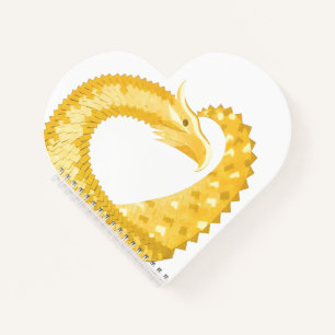 Yellow heart dragon on white notebook