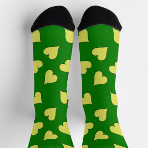 Yellow hearts pattern on green socks