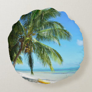 Yellow kayak on a white sand beach round pillow