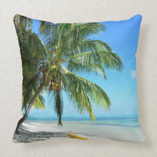 Yellow kayak on a white sand beach throw pillow