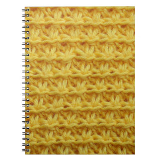 Yellow knitted fabric: striped texture. notebook
