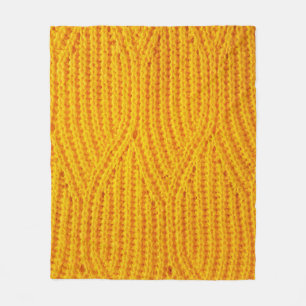 Yellow knitted surface textile material background fleece blanket