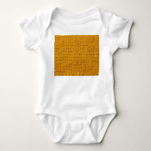 Yellow knitted wool, high-resolution texture. baby bodysuit