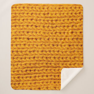 Yellow knitted wool texture background pattern wit sherpa blanket