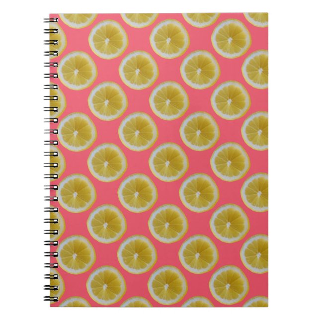 Yellow lemon slices on pink notebook (Front)
