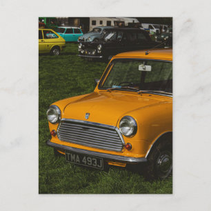 Yellow mini cooper classic car postcard