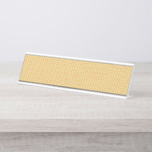Yellow, orange, and brown sheets of wrapping paper desk name plate