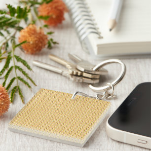 Yellow, orange, and brown sheets of wrapping paper key ring