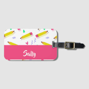 Yellow pencils and scrabbles on white luggage tag