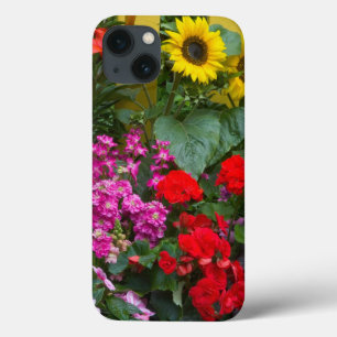 Yellow picket fence with flower garden in iPhone 13 case