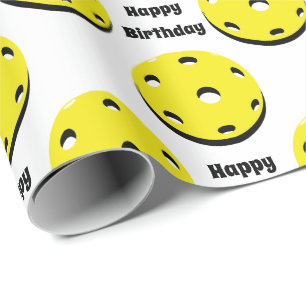 Yellow pickleballs all over wrapping paper