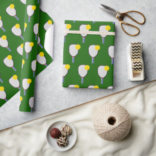 Yellow Pickleballs and Paddles On Green Wrapping Paper