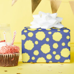 Yellow polka dot circles on blue wrapping paper