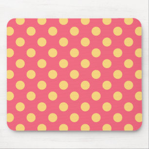 Yellow polka dots on coral mouse mat