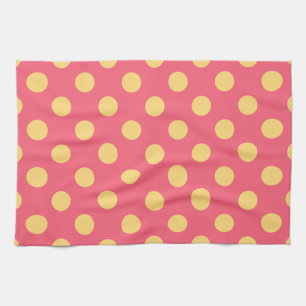 Yellow polka dots on coral tea towel