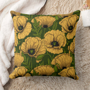 Yellow poppies on dark green cushion