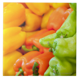 Yellow, red and green pepper on sale at farmer's tile
