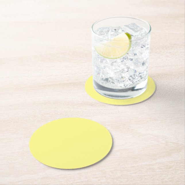 Yellow solid colour light-medium, round paper coaster (Insitu)