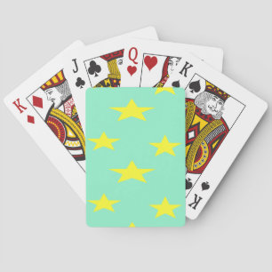 Yellow stars on turquoise playing cards