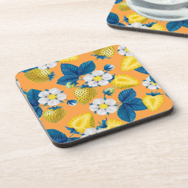 Yellow strawberries on orange coaster (Left Side)