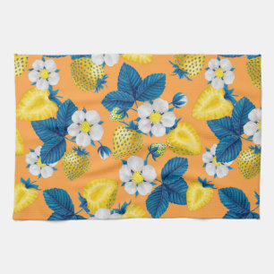 Yellow strawberries on orange tea towel