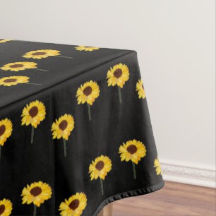 Yellow sunflowers on black tablecloth