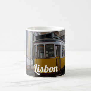 Yellow tram on Lisbon Cathedral in Portugal Coffee Mug
