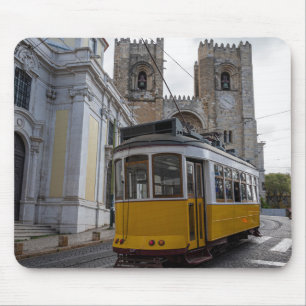 Yellow tram on Lisbon Cathedral in Portugal Mouse Mat