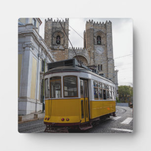 Yellow tram on Lisbon Cathedral in Portugal Plaque