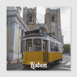 Yellow tram on Lisbon Cathedral Portugal