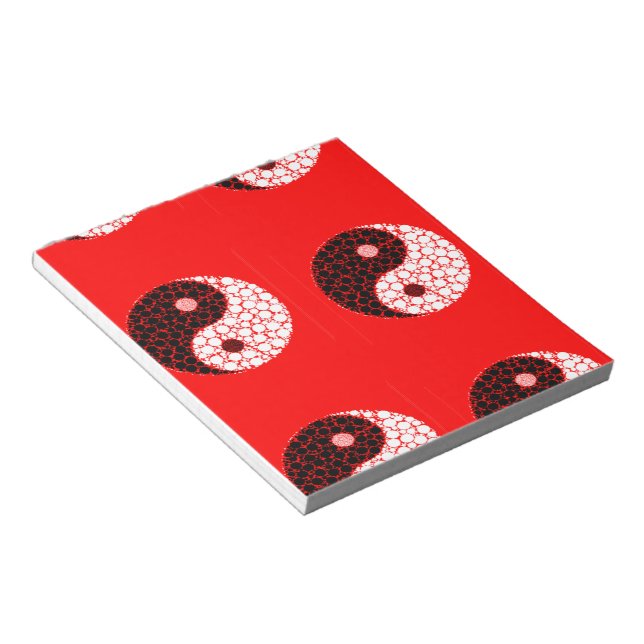 Ying yang circles on red notepad (Angled)