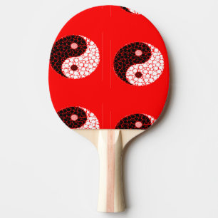 Ying yang circles on red ping pong paddle