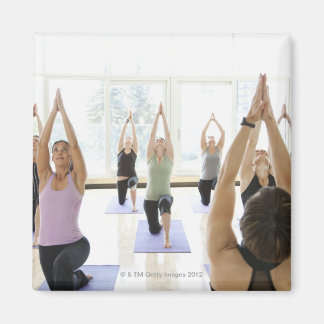 Yoga instructor leading class through the magnet