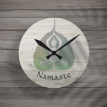 Yoga Instructor Studio Meditation Pose Bodhi Leaf Round Clock<br><div class="desc">Yoga Studio Meditation Instructor / Life Coach / Healer / Reiki Master / Massage Therapy Clocks Template.
Elegant Green Bodhi Leaf and and Yogi in Easy Seat pose / YOGA Easy Pose / Sukhasana Pose on on White Wood Background.</div>