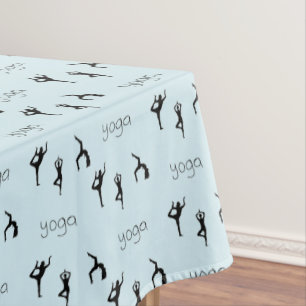 Yoga poses and text pattern on blue tablecloth