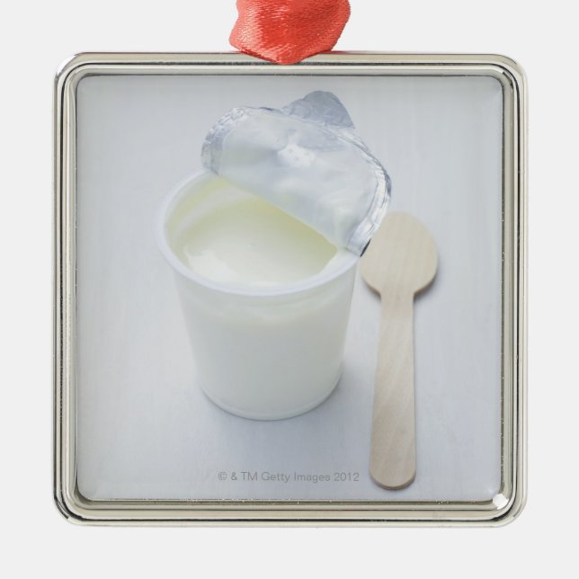 Yoghurt in opened disposable cup metal tree decoration (Front)