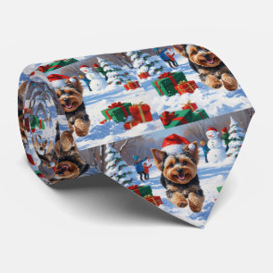 Yorkipoo Running in Snow with Christmas Hat Tie