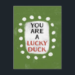 You Are A Lucky Duck Postcard<br><div class="desc">Bold text reading "You Are A Lucky Duck" is centred against a green background. The orange and black text sits on a white rectangle with large textured white dots around it,  providing a playful contrast against the solid colour backdrop.</div>
