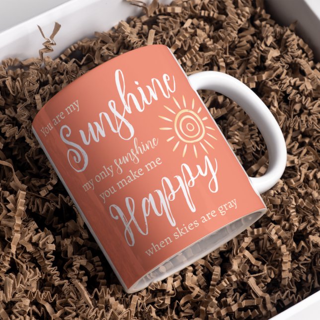 You Are My Sunshine Make Me Happy Sun Peach Orange Coffee Mug (You Are My Sunshine You Make Me Happy song lyrics on a bright peach background with yellow sun.)