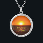 You are my sunshine necklace<br><div class="desc">This lovely quote along with this picture of the sunset that I took, will win her/his heart.</div>