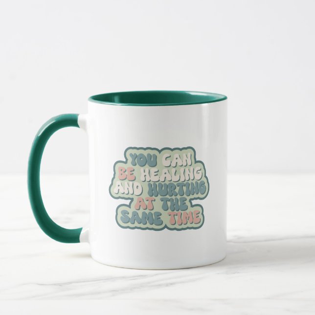 You can be healing and hurting at the same time mug (Left)