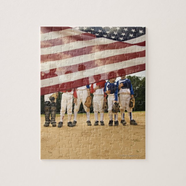 Young baseball players partially hidden by jigsaw puzzle (Vertical)