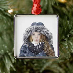 Young beautiful girl in winter metal tree decoration