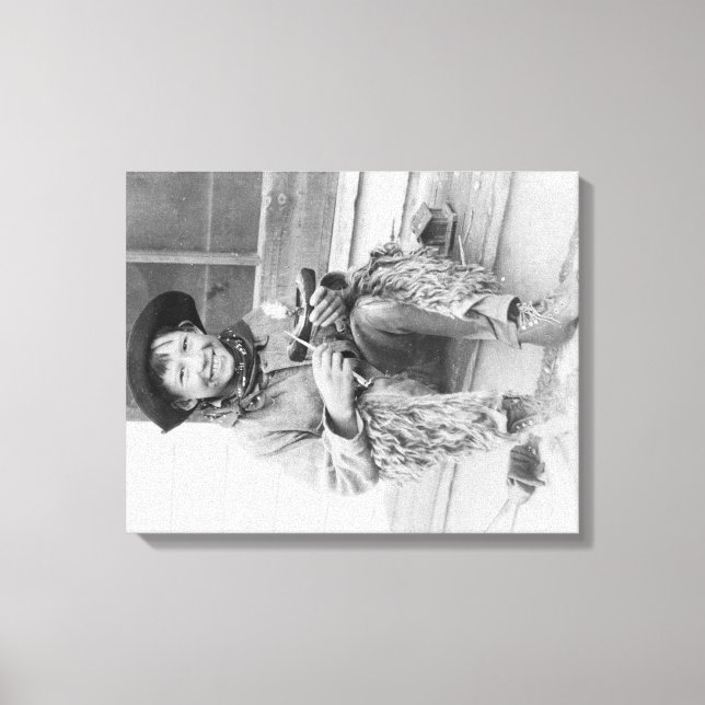 Young Boy Dressed as Cowboy with Toys Canvas Print (Front)